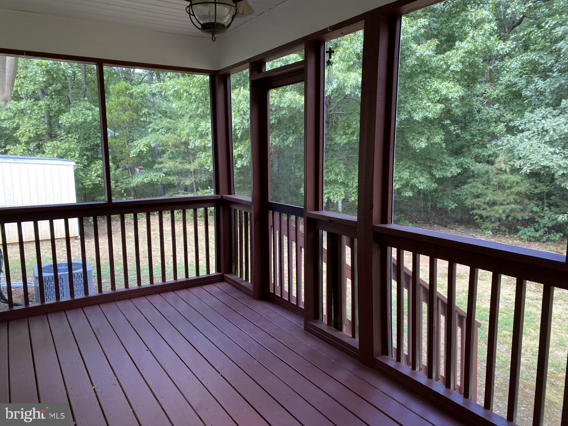 550 Walnut Shade Road Louisa, VA 23093 - Photo 7 of 7 a view of a wooden balcony with outdoor space