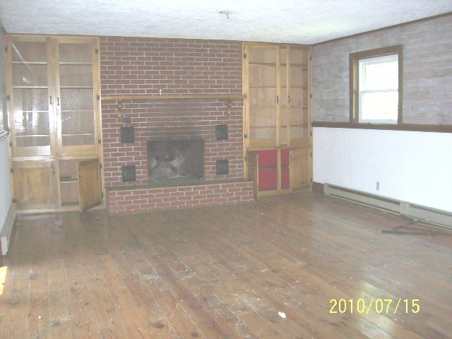 3607 Fort Chiswell Road Max Meadows, VA 24360 - Photo 3 of 9 a view of an empty room with a fireplace