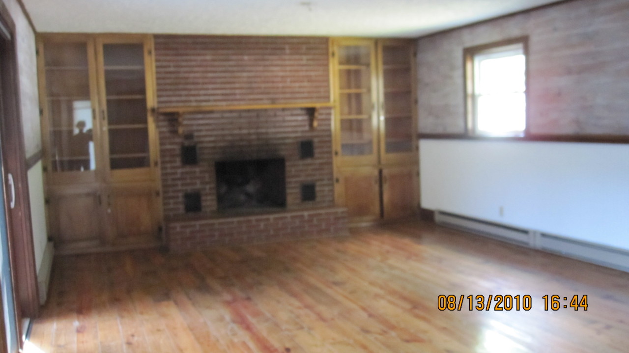 3607 Fort Chiswell Road Max Meadows, VA 24360 - Photo 9 of 9 a view of wooden floor and a fireplace in a room