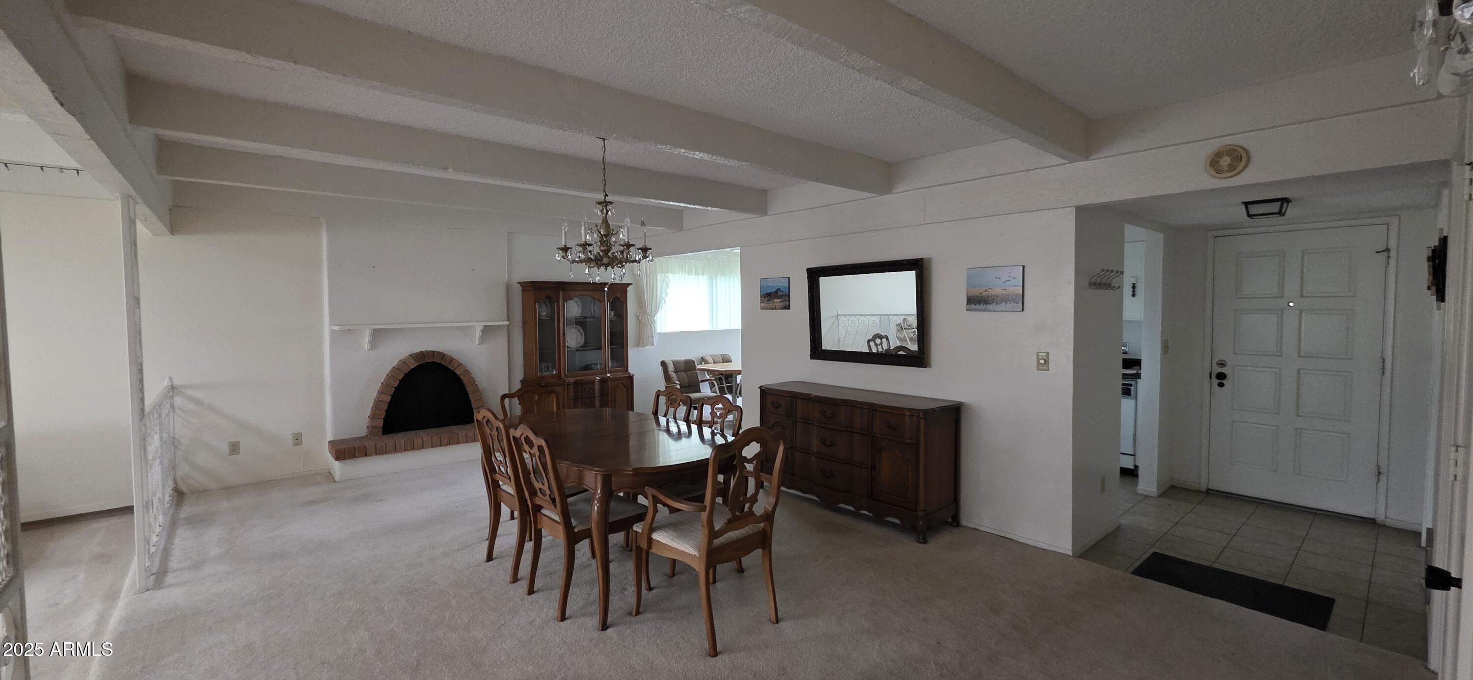 302 North Sage Street Pearce, AZ 85625 - Photo 13 of 38 a dining room with furniture and window
