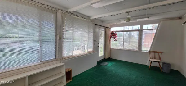 a view of an empty room with a window