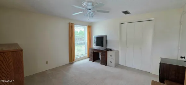 a view of a hallway with a bedroom