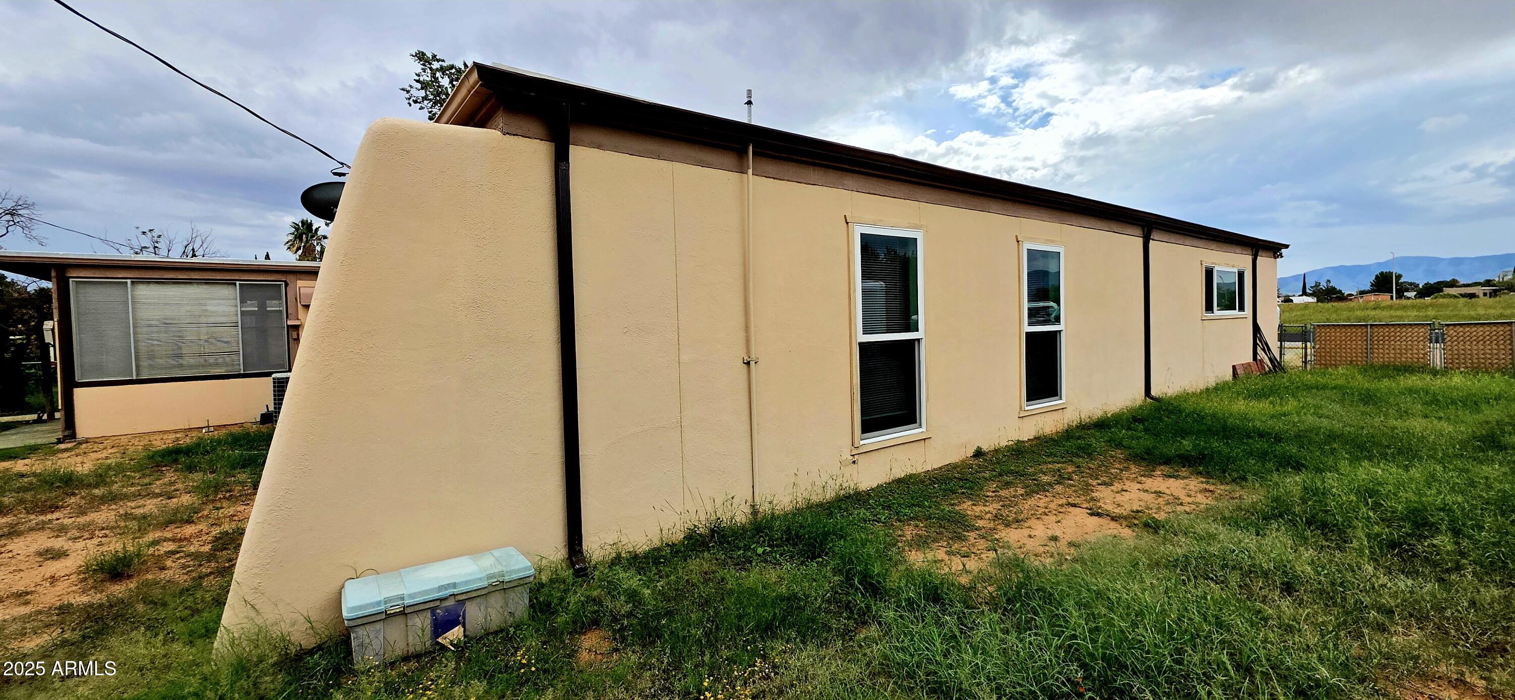 302 North Sage Street Pearce, AZ 85625 - Photo 38 of 38 a front view of a house with garden