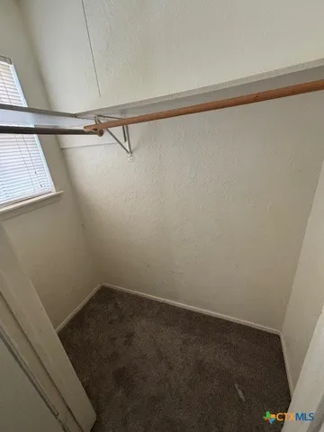 a view of a room with racks on the wall