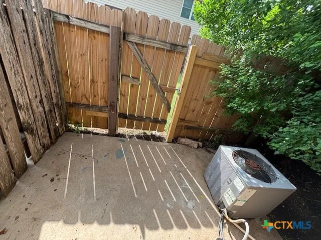 a view of balcony with wooden floor and fence