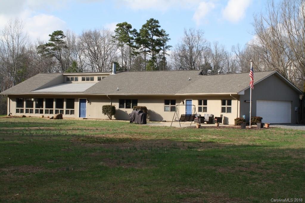 a front view of house with yard outdoor seating and green space