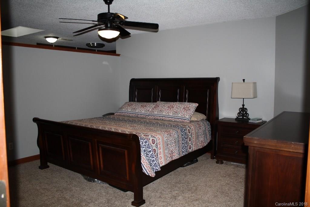 15850 Short Cut Road Gold Hill, NC 28071 - Photo 11 of 18 a bedroom with a bed and furniture