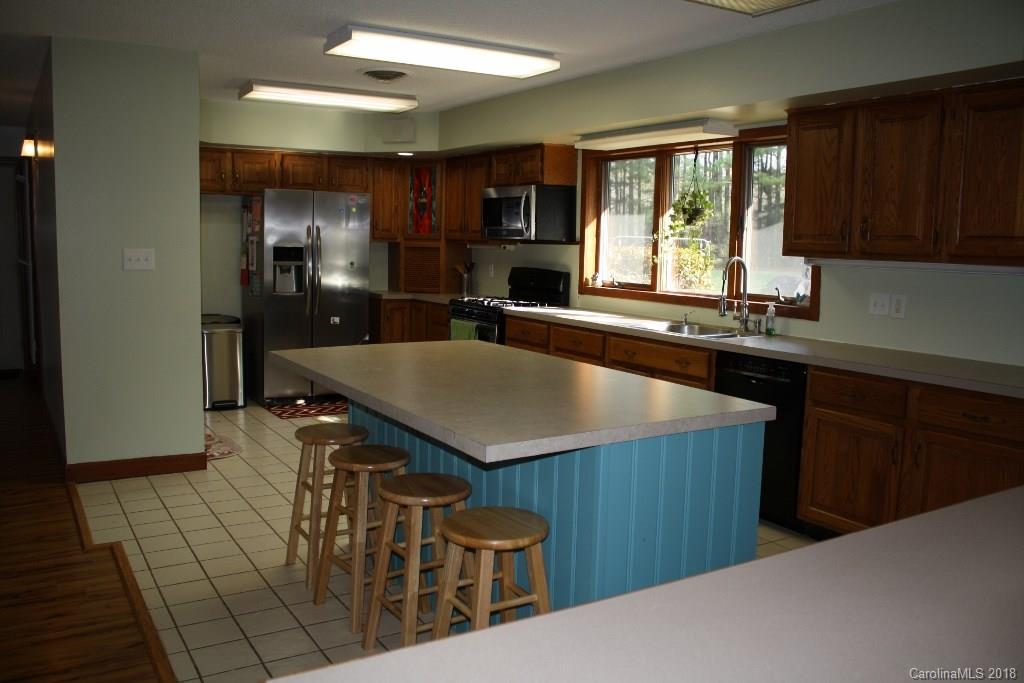15850 Short Cut Road Gold Hill, NC 28071 - Photo 13 of 18 a kitchen with a sink a counter top space and stainless steel appliances