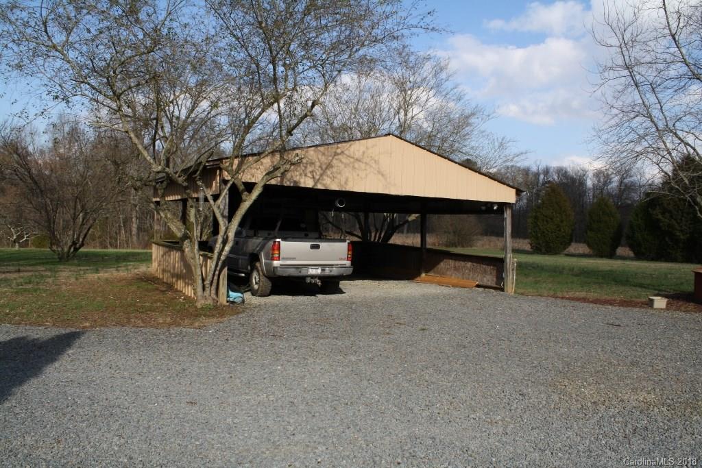 15850 Short Cut Road Gold Hill, NC 28071 - Photo 5 of 18 a view of a car parked in garage