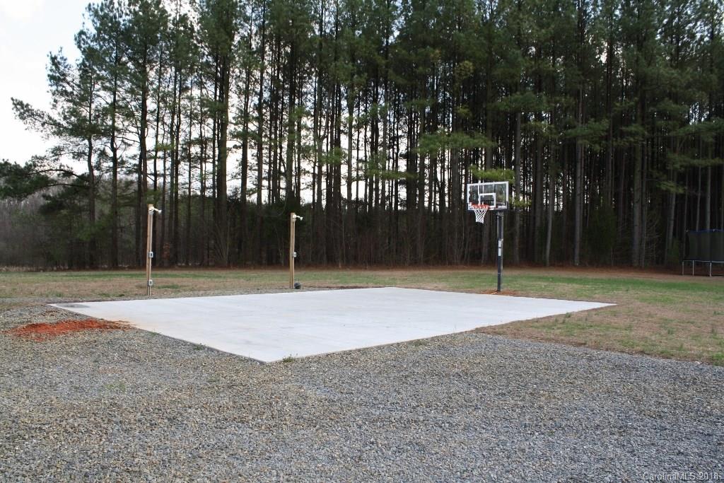 15850 Short Cut Road Gold Hill, NC 28071 - Photo 6 of 18 a backyard of a house with lots of trees