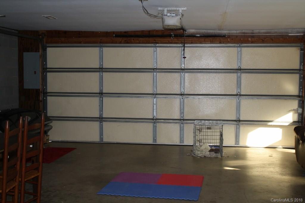 15850 Short Cut Road Gold Hill, NC 28071 - Photo 7 of 18 a view of a room with racks on the wall and a window