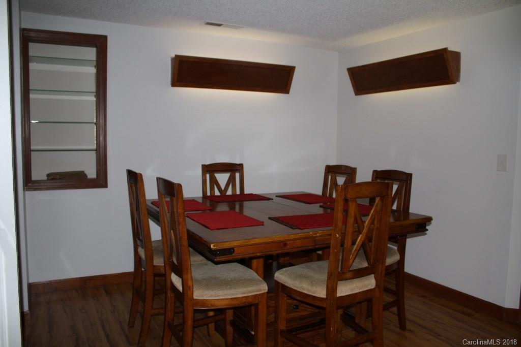 15850 Short Cut Road Gold Hill, NC 28071 - Photo 10 of 18 a view of a dining room with furniture and wooden floor