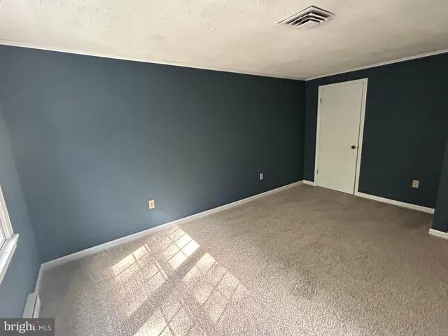 a view of a big room with windows