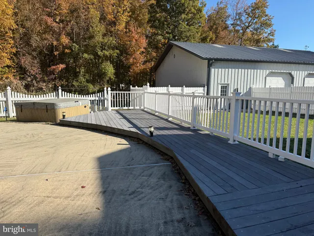 a view of a balcony with wooden floor