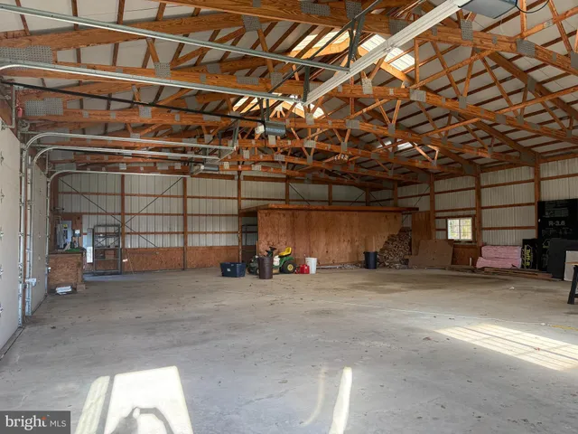 a view of a garage with parked cars