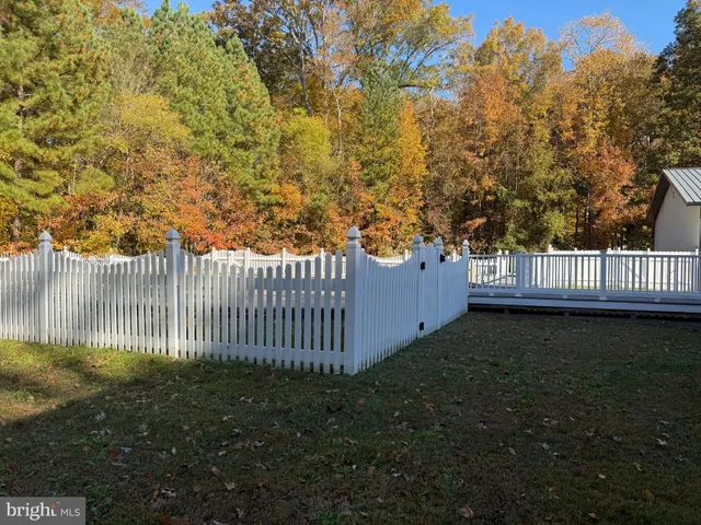 a view of a bench in the backyard