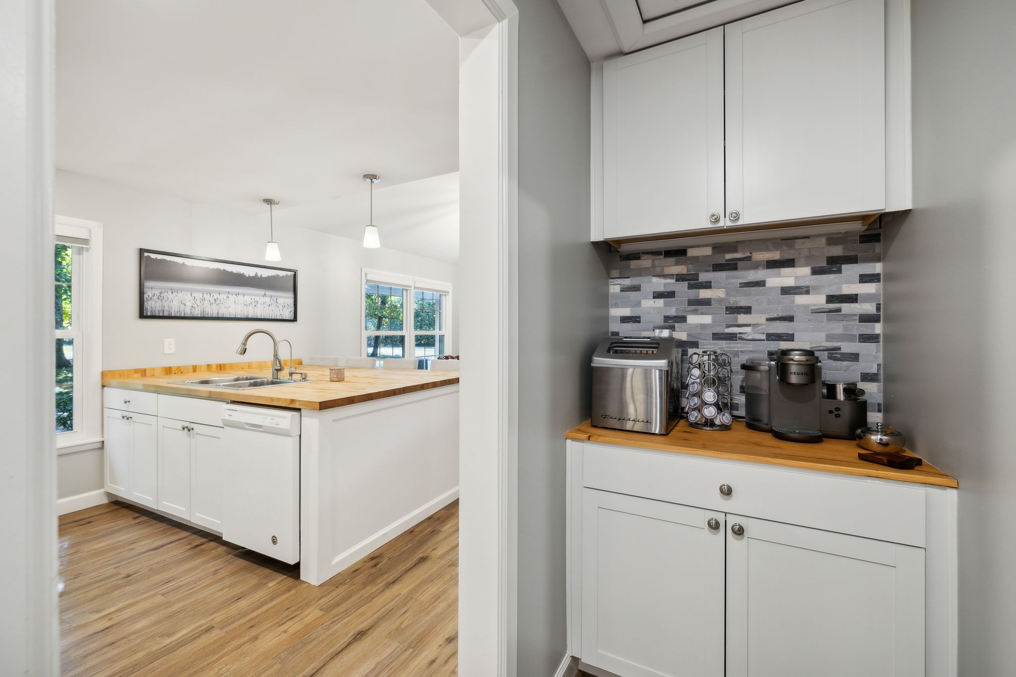 441 Scruggs Hollow Road Rockvale, TN 37153 - Photo 12 of 44 A stylish tile backsplash and a coffee bar with storage add the perfect finishing touches, making this kitchen a delightful space for culinary creativity. 441 Scruggs Hollow Rd Rockvale, TN 37153