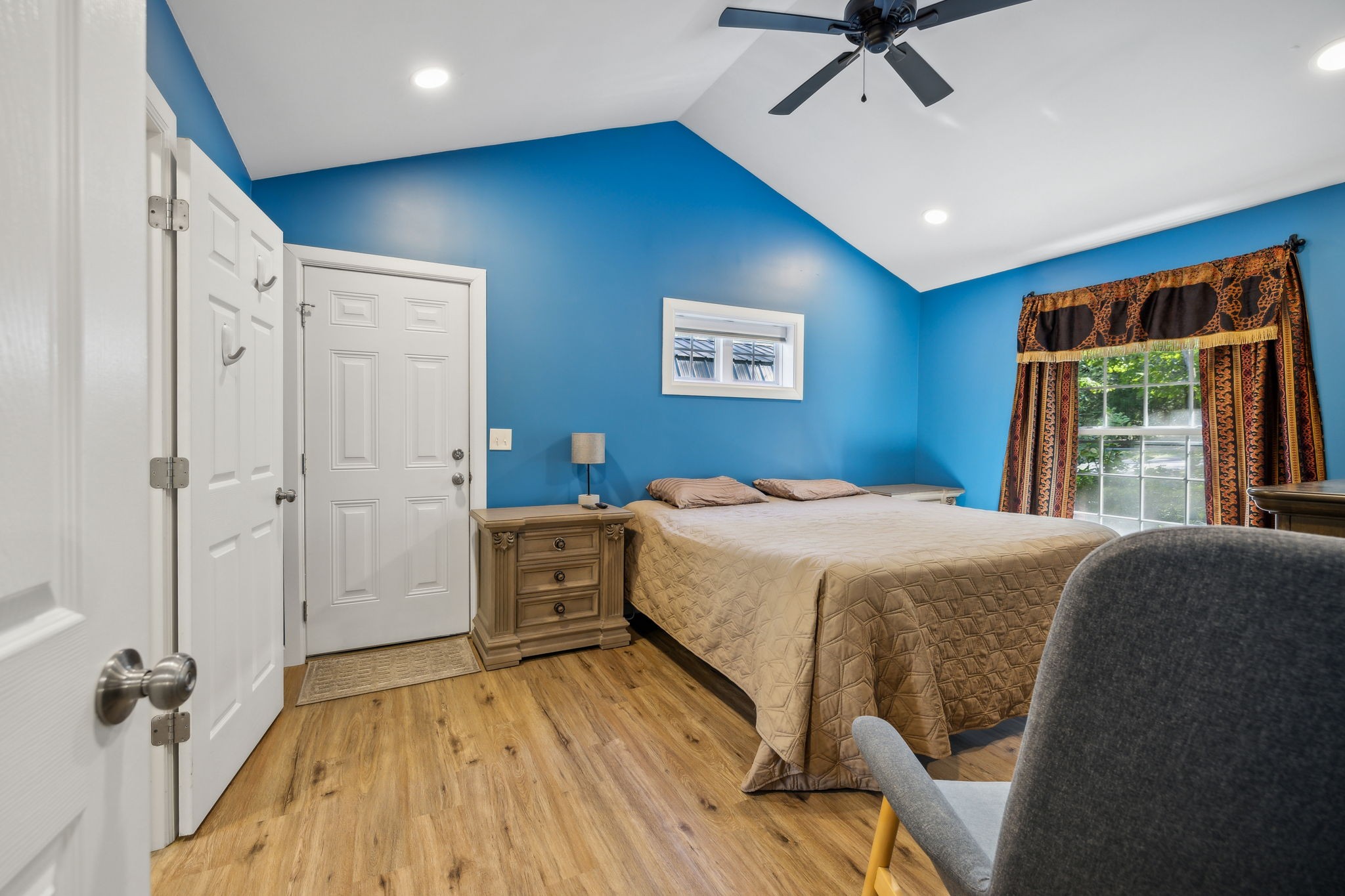 441 Scruggs Hollow Road Rockvale, TN 37153 - Photo 14 of 44 This spacious primary bedroom features a vaulted ceiling and a ceiling fan, offering both style and comfort. 441 Scruggs Hollow Rd Rockvale, TN 37153