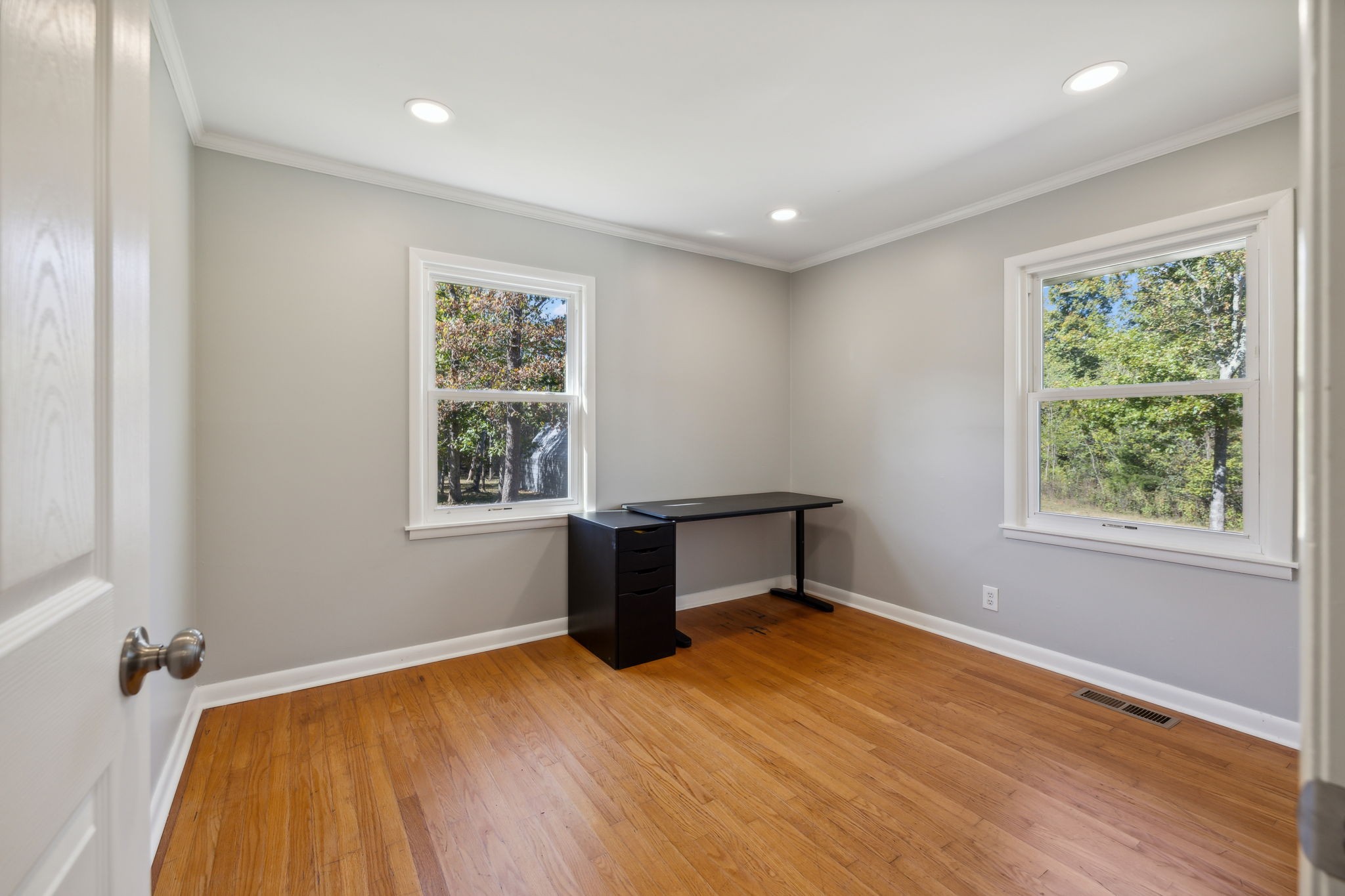 441 Scruggs Hollow Road Rockvale, TN 37153 - Photo 18 of 44 Bedroom 2 features two single windows,real hardwood floors, recessed lighting, crown molding, and a neutral paint scheme, creating a bright space.441 Scruggs Hollow Rd Rockvale, TN 37153