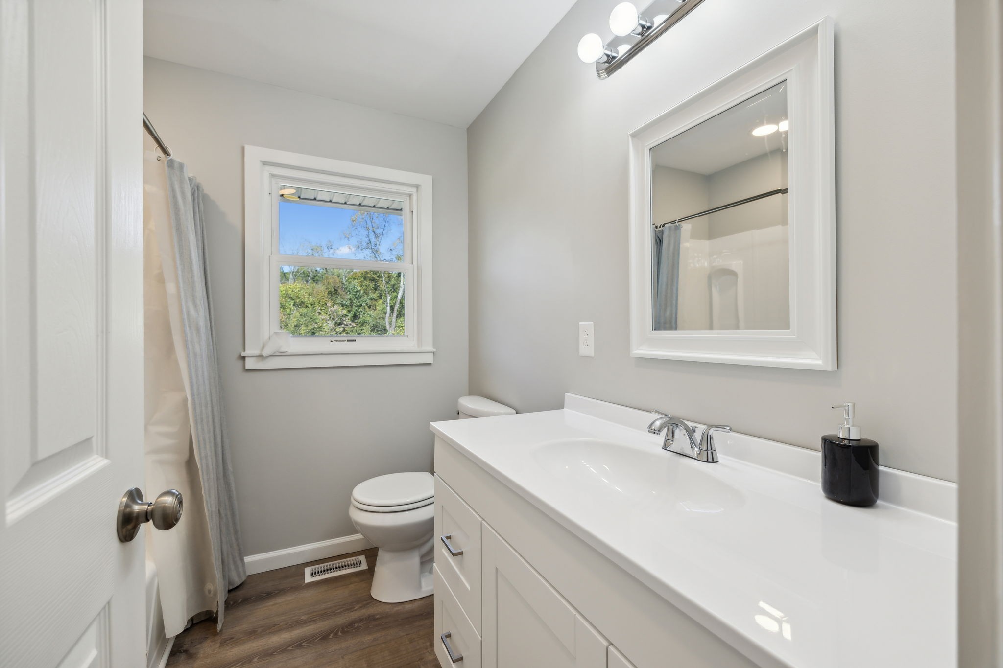 441 Scruggs Hollow Road Rockvale, TN 37153 - Photo 19 of 44 Bathroom 2 offers a spacious single vanity with storage below and a convenient shower-tub combo, blending functionality with comfort. 441 Scruggs Hollow Rd Rockvale, TN 37153