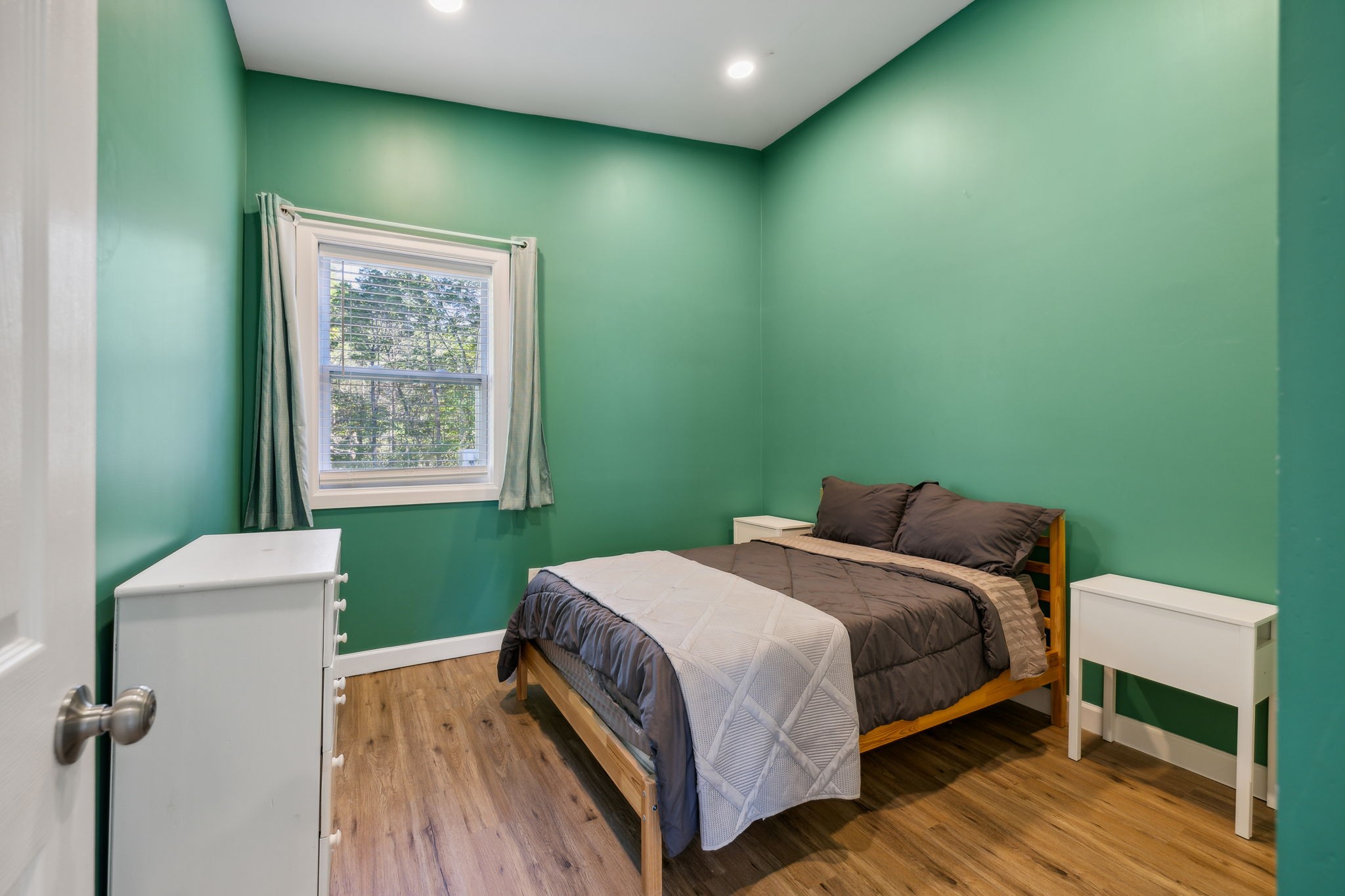 441 Scruggs Hollow Road Rockvale, TN 37153 - Photo 22 of 44 The third bedroom features recessed lighting and a single window, providing a well-lit and inviting atmosphere.441 Scruggs Hollow Rd Rockvale, TN 37153