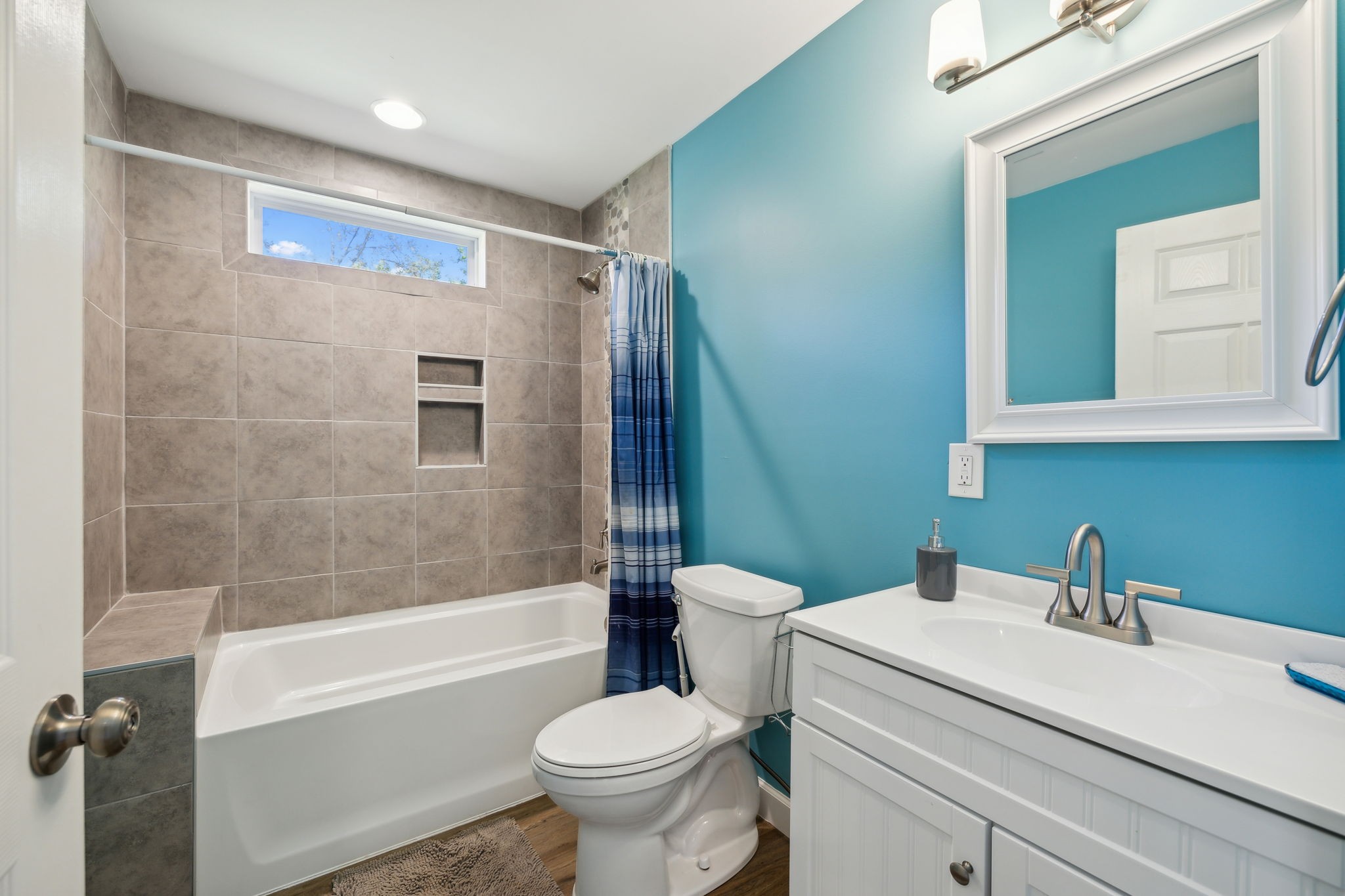 441 Scruggs Hollow Road Rockvale, TN 37153 - Photo 23 of 44 Bathroom 3 includes a combo shower-tub with recessed lighting and a single vanity, offering both functionality and style. 441 Scruggs Hollow Rd Rockvale, TN 37153