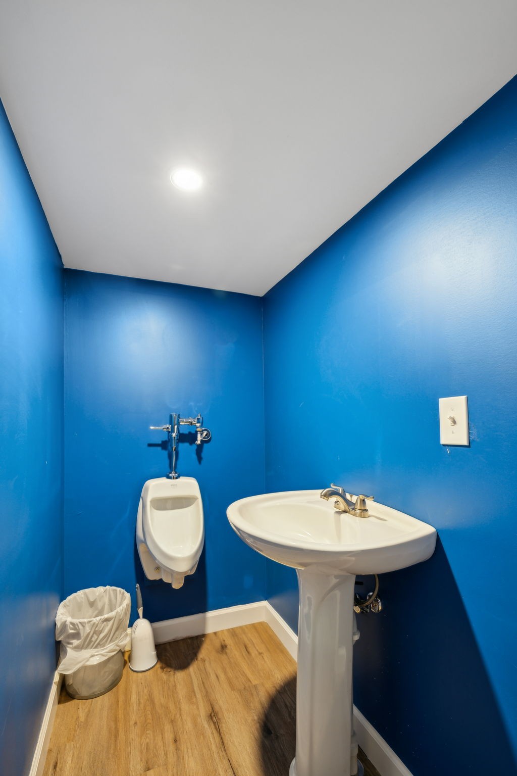 441 Scruggs Hollow Road Rockvale, TN 37153 - Photo 32 of 44 Additionally, the office has a separate sink and urinal, offering practical amenities. 441 Scruggs Hollow Rd Rockvale, TN 37153