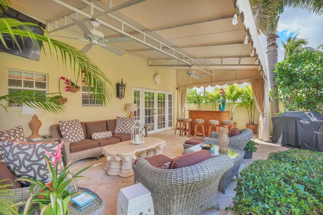 a outdoor space with patio the couches and a dining table with garden view