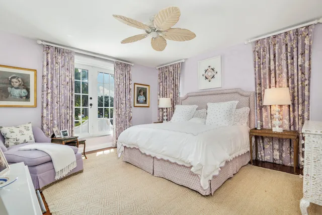 a bed room with a bed and a chandelier