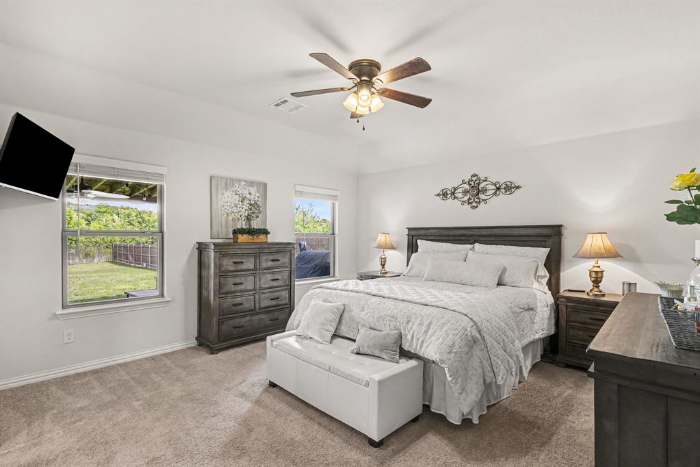 1237 Rushmore Drive Burleson, TX 76028 - Photo 11 of 28 a bedroom with a bed and a couch