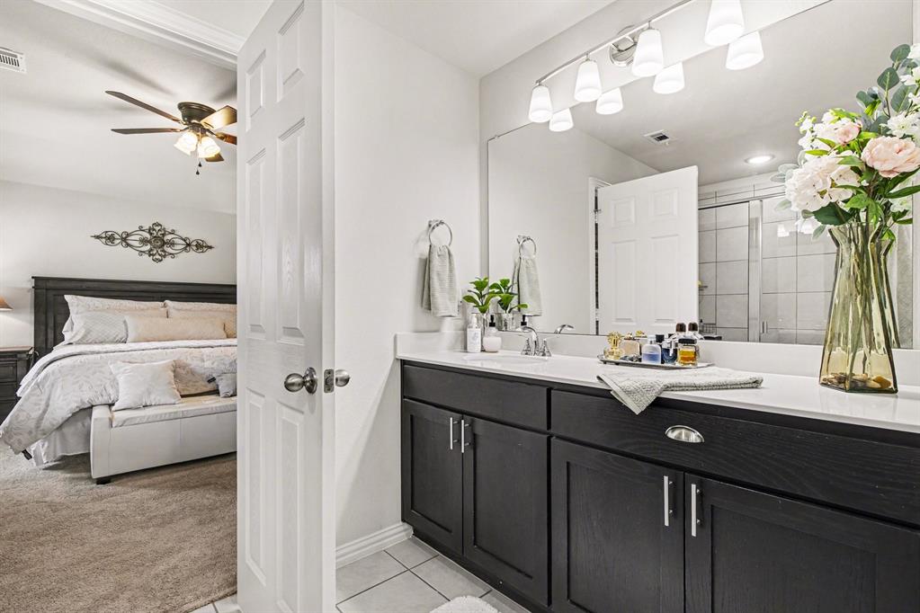 1237 Rushmore Drive Burleson, TX 76028 - Photo 13 of 28 a bathroom with a sink double vanity and a mirror