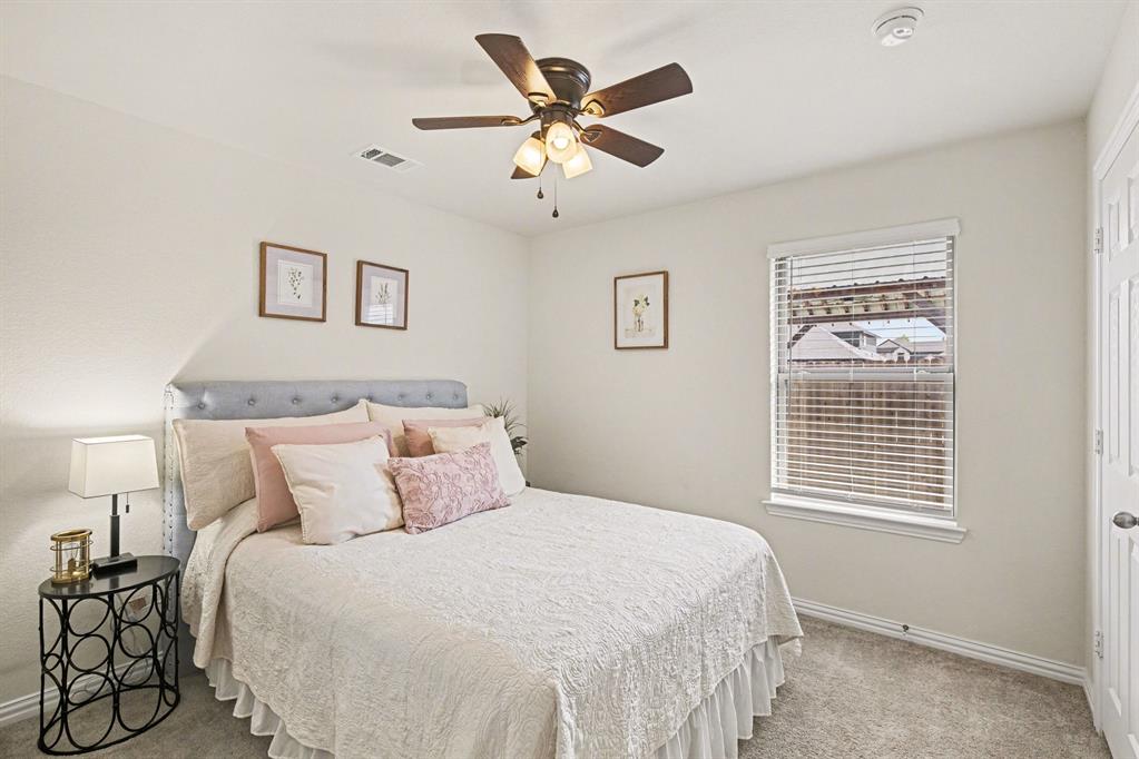 1237 Rushmore Drive Burleson, TX 76028 - Photo 16 of 28 a bedroom with a bed and window