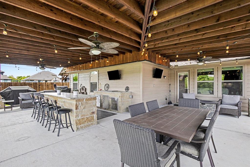 1237 Rushmore Drive Burleson, TX 76028 - Photo 21 of 28 a view of a dinning table and chairs in patio