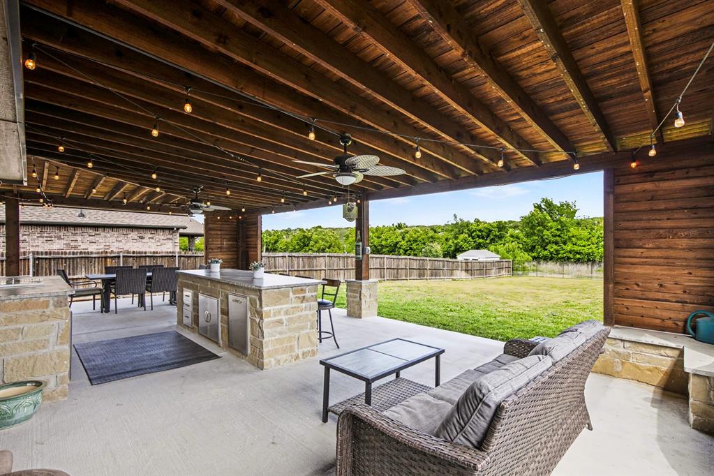 1237 Rushmore Drive Burleson, TX 76028 - Photo 23 of 28 a patio with yard table and chairs