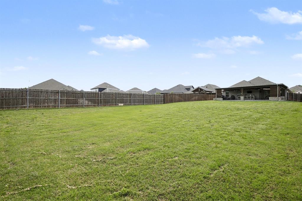 1237 Rushmore Drive Burleson, TX 76028 - Photo 25 of 28 a view of a house with a garden and lake view