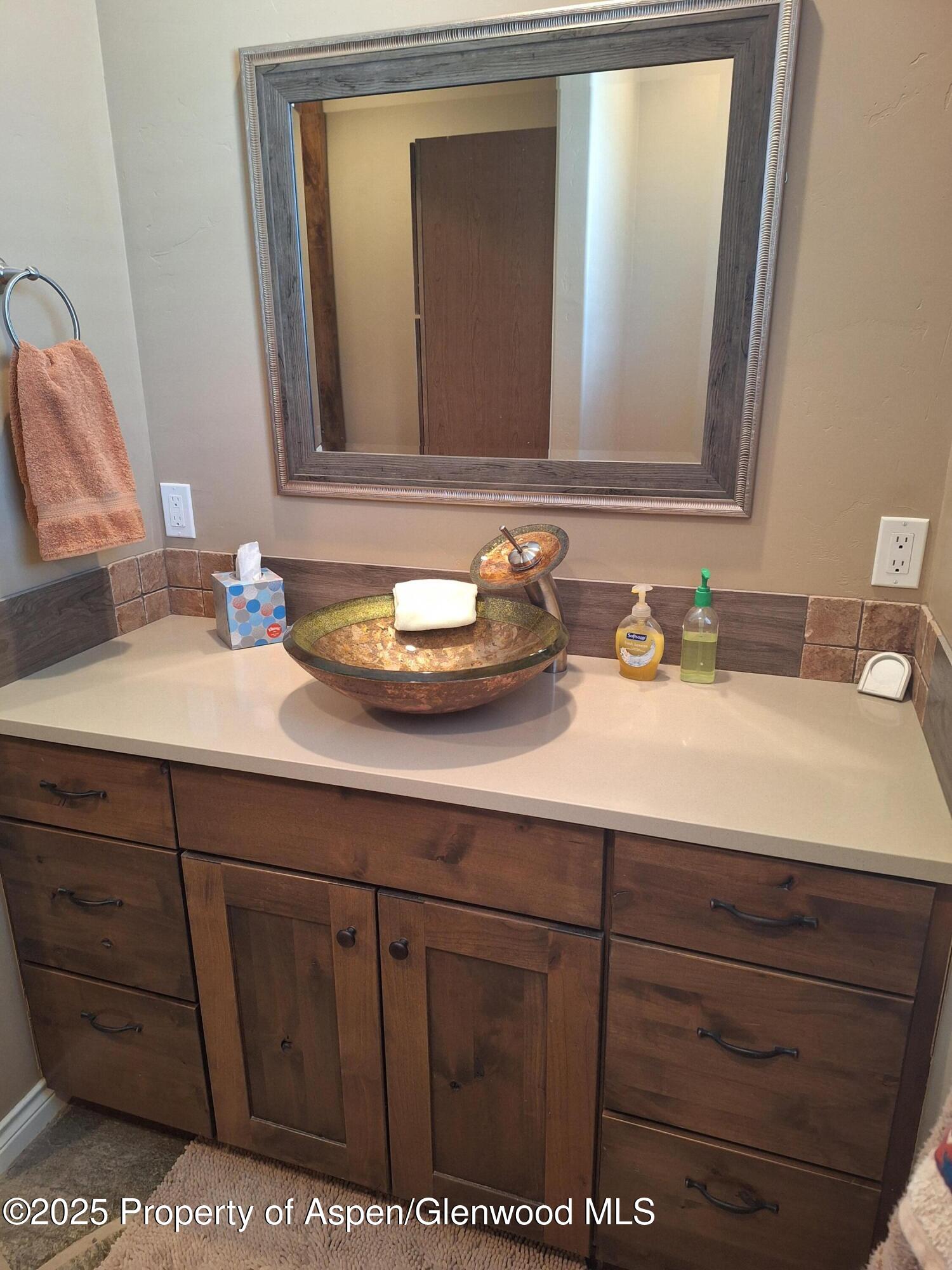 265 South Meadow Drive Rifle, CO 81650 - Photo 68 of 76 a bathroom with a sink and a mirror