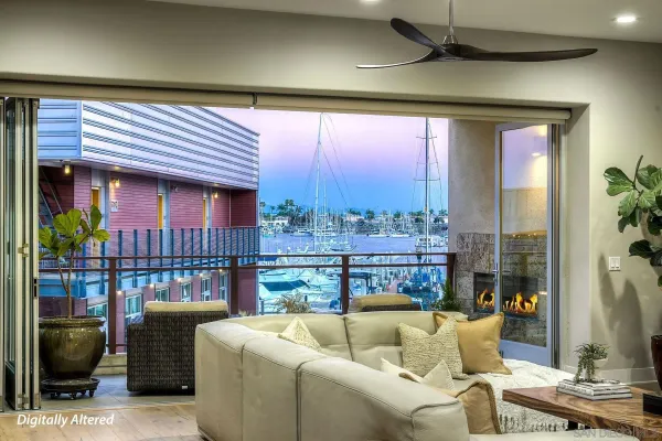 a living room with furniture and a floor to ceiling window