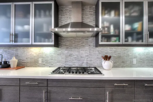 a kitchen with a stove and a sink