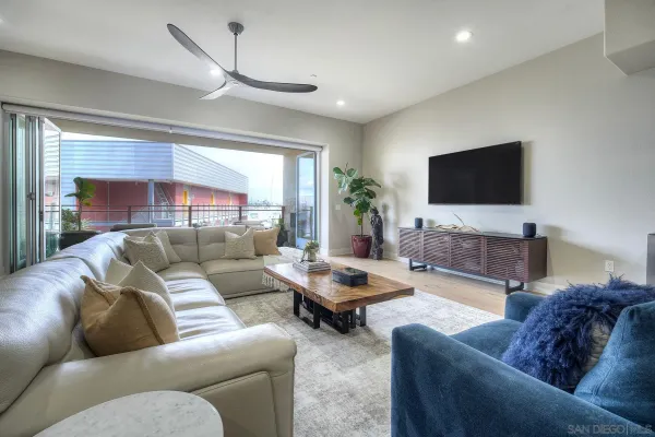 a living room with furniture and a flat screen tv