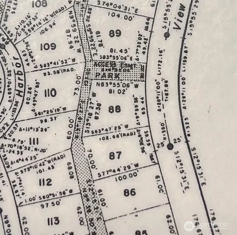 a view of a lake with houses in the back