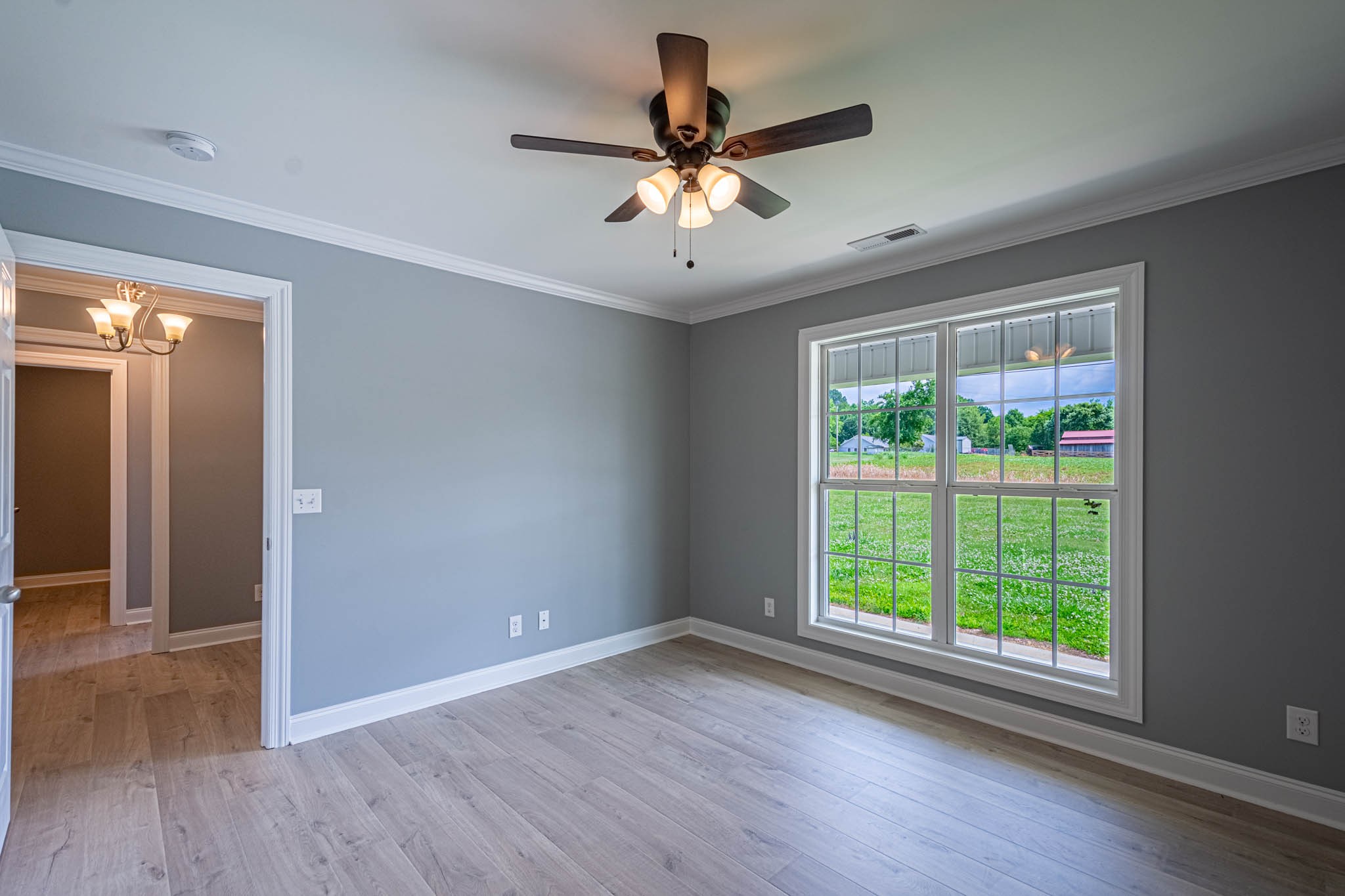 901 Cedar Pl Road Pulaski, TN 38478 - Photo 34 of 59 wooden floor in an empty room with a window