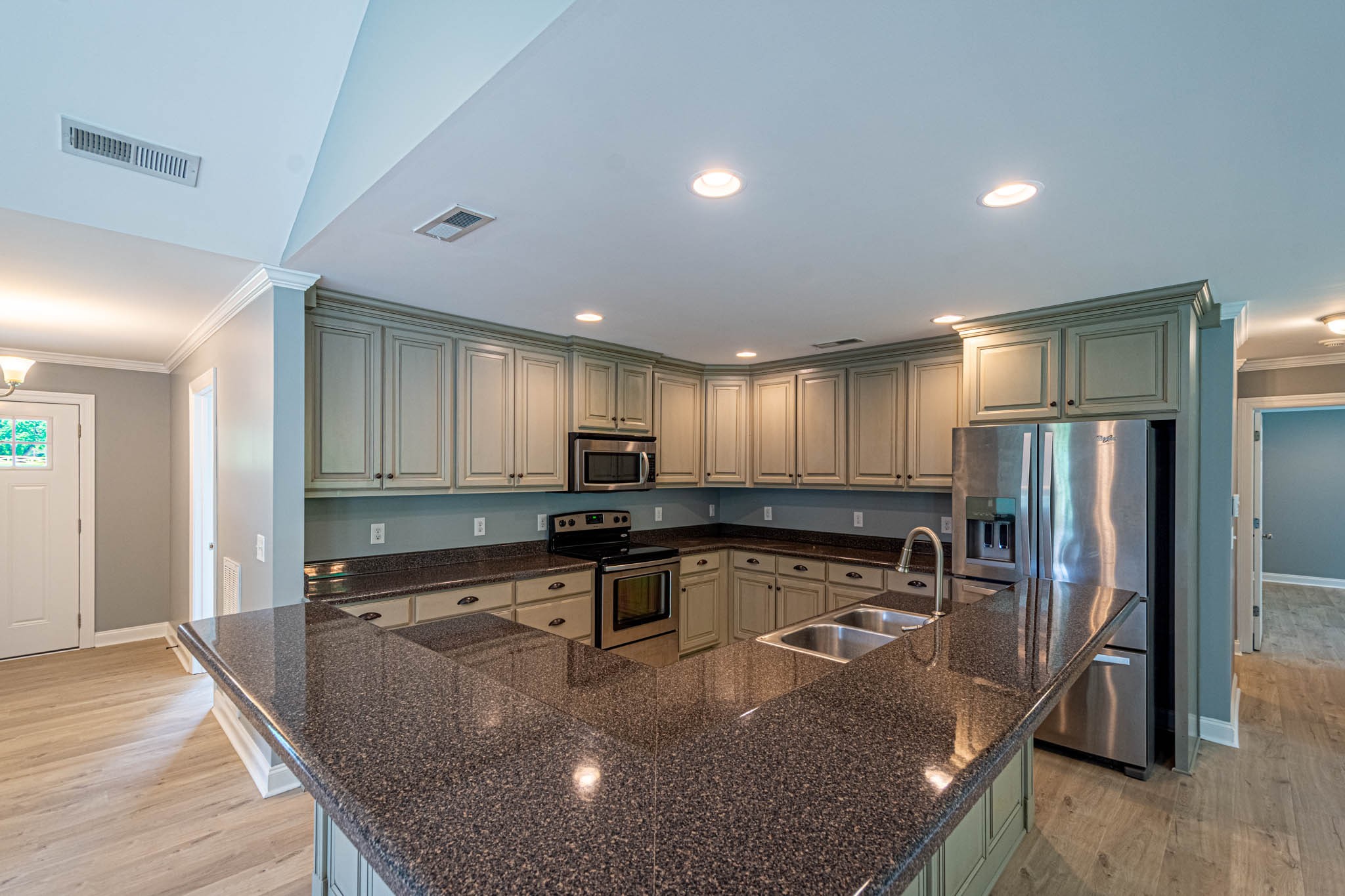 901 Cedar Pl Road Pulaski, TN 38478 - Photo 10 of 59 a kitchen with stainless steel appliances granite countertop a sink stove and refrigerator
