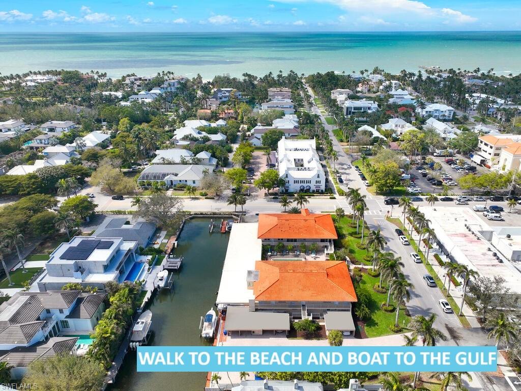 an aerial view of residential building and ocean