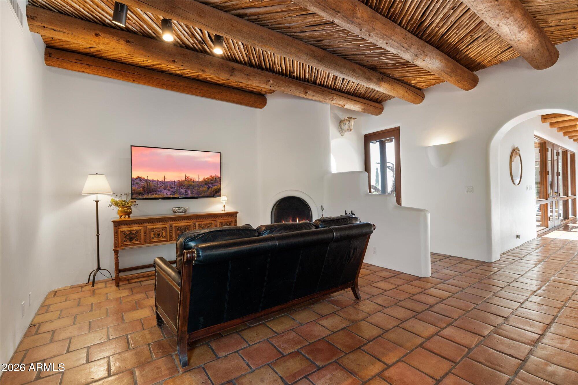 34815 North Arroyo Road Carefree, AZ 85377 - Photo 11 of 60 a living room with furniture and a flat screen tv