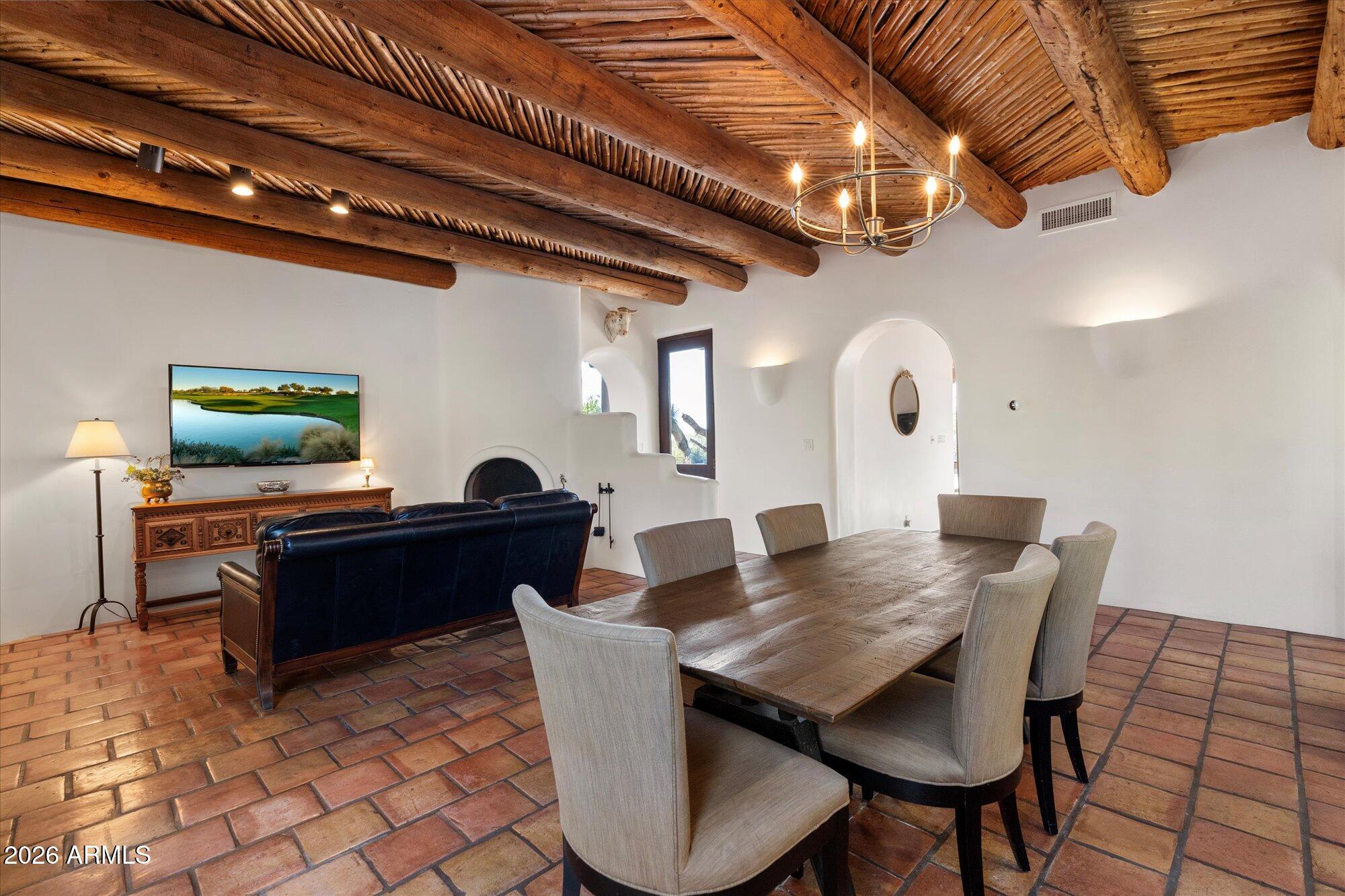 34815 North Arroyo Road Carefree, AZ 85377 - Photo 12 of 60 a living room with furniture and a flat screen tv