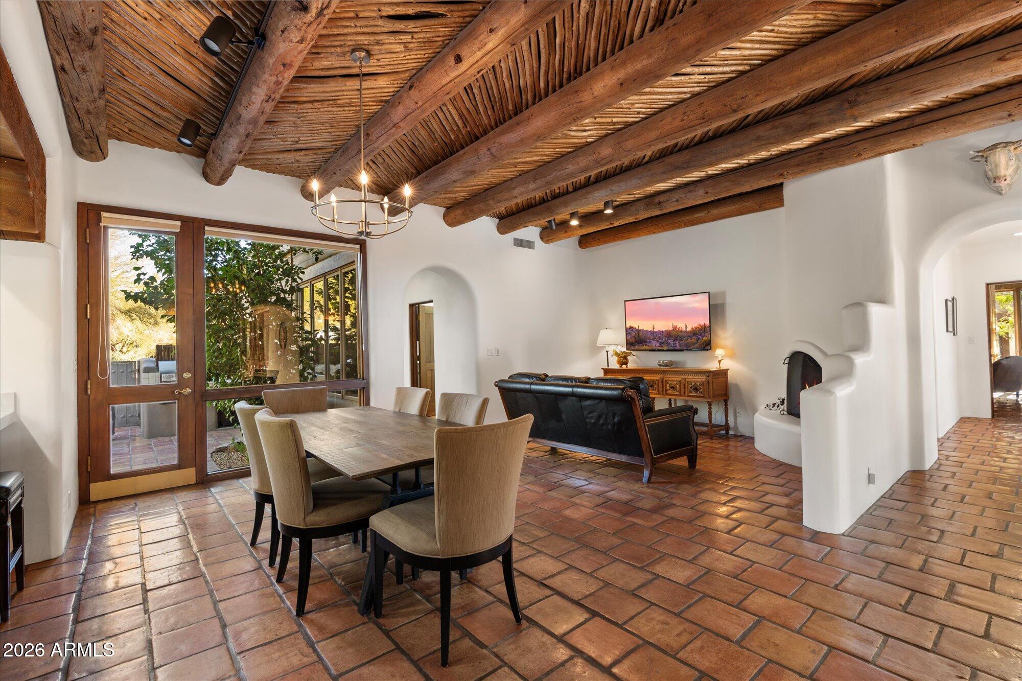 34815 North Arroyo Road Carefree, AZ 85377 - Photo 13 of 60 a dining room with furniture and a floor to ceiling window