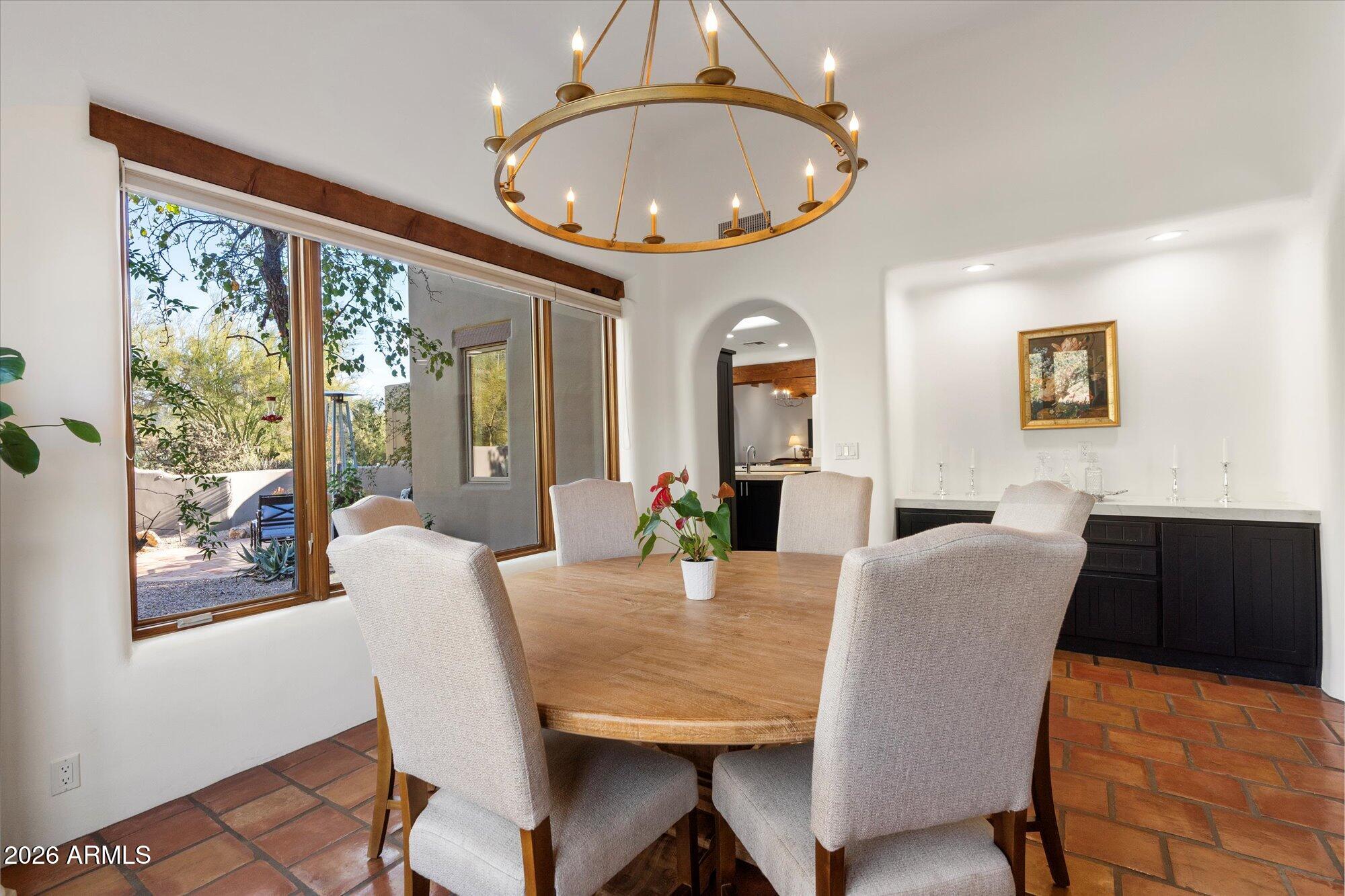 34815 North Arroyo Road Carefree, AZ 85377 - Photo 16 of 60 a view of a dining room with furniture window and wooden floor