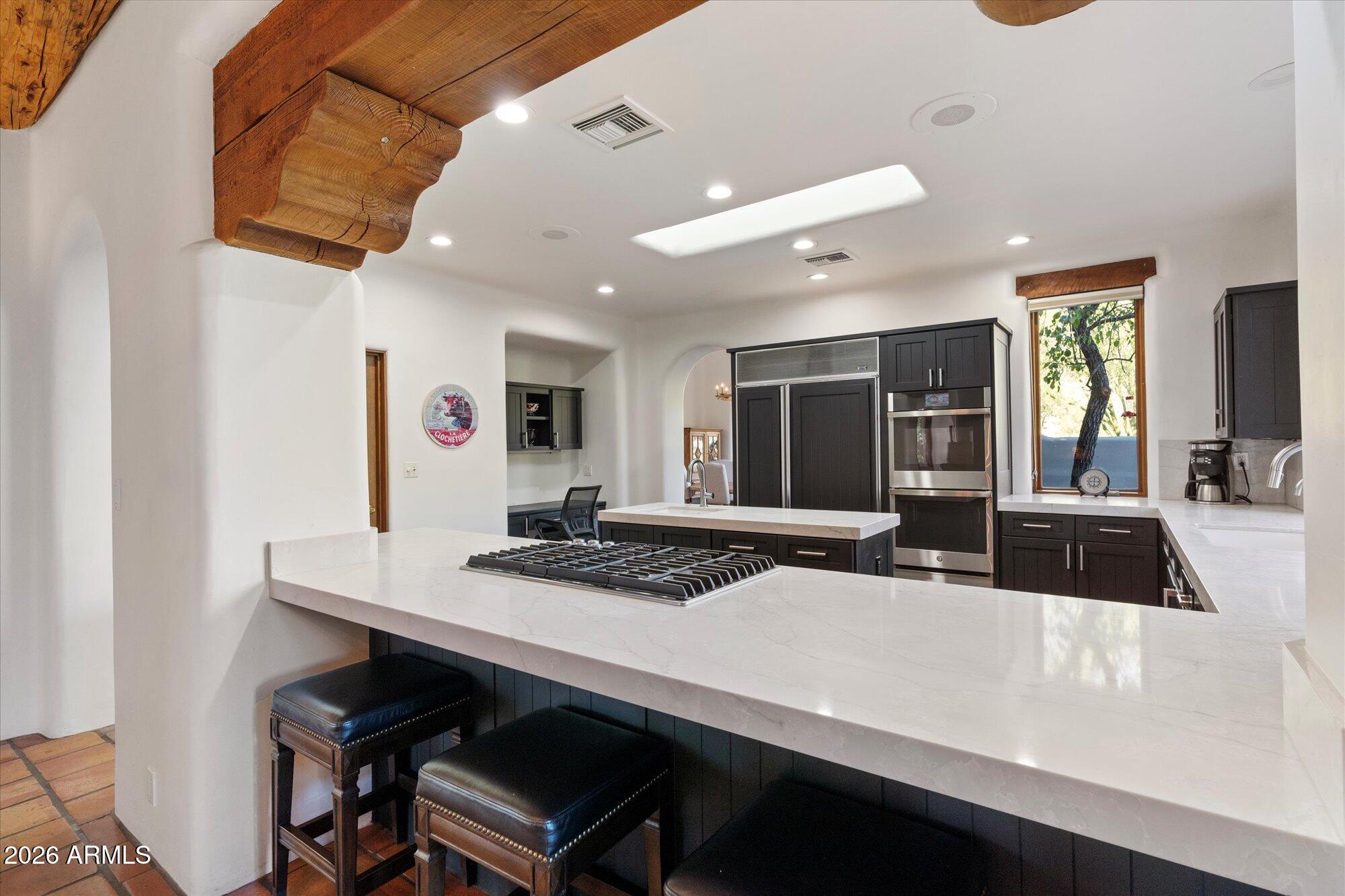 34815 North Arroyo Road Carefree, AZ 85377 - Photo 17 of 60 a kitchen with a table and chairs