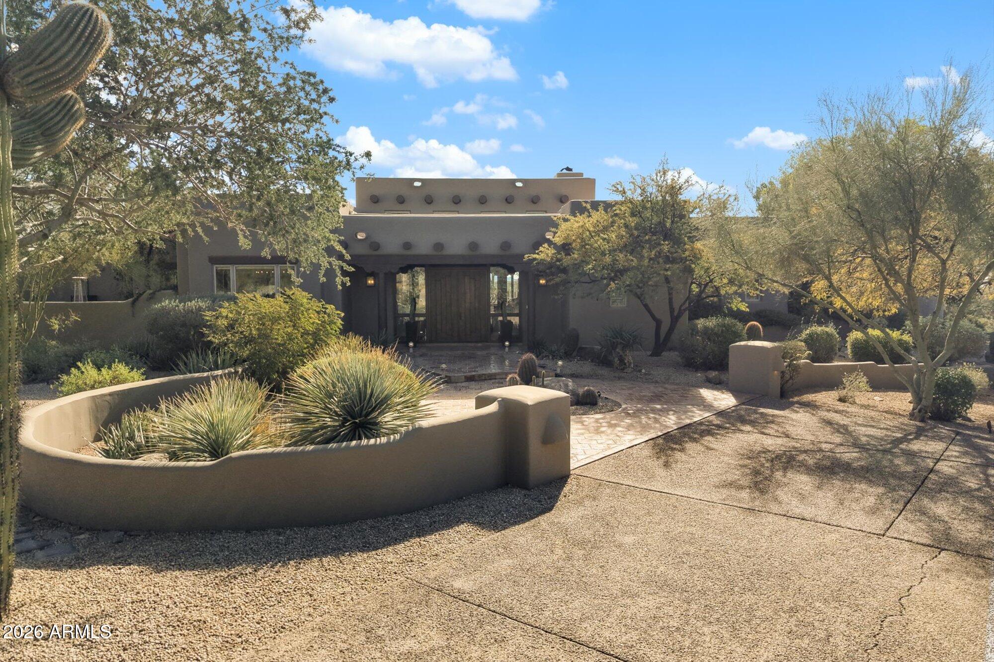 34815 North Arroyo Road Carefree, AZ 85377 - Photo 2 of 60 a view of a house with a yard fire pit and outdoor seating