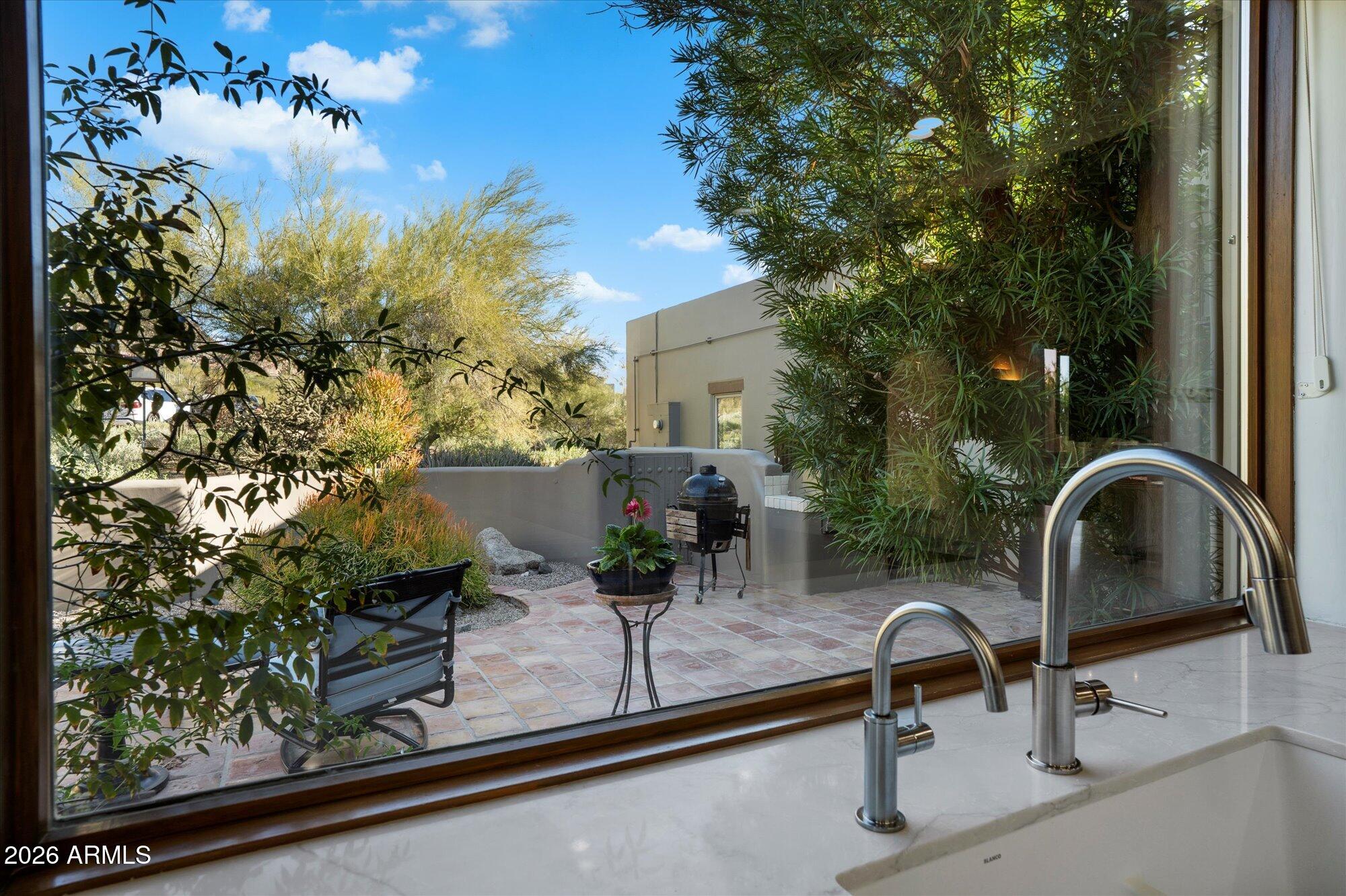 34815 North Arroyo Road Carefree, AZ 85377 - Photo 23 of 60 a table and chairs sitting in front of a building